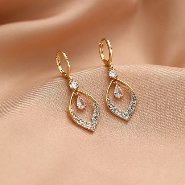 A Woman With Elegant Zircon Water Drop Tassel Earrings